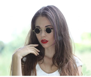 Outdoor lifestyle shot of steampunk sunglasses with gold metal frames and round lenses