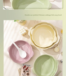 Close-up of pastel ceramic soup bowls with double handles in pink yellow and green