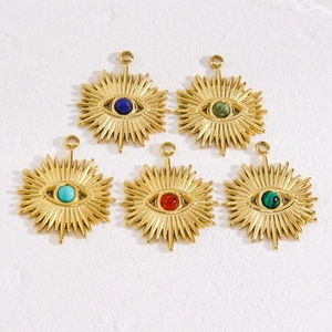 Five gold stainless steel sunburst eye pendants with colorful gemstone inlays