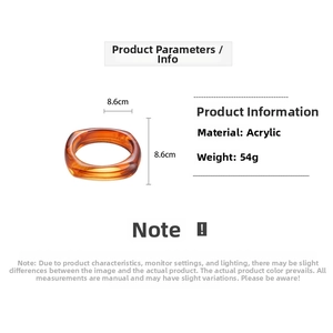 Detail shot of amber acrylic bangle showing 8.6cm inner diameter and 54g weight specs