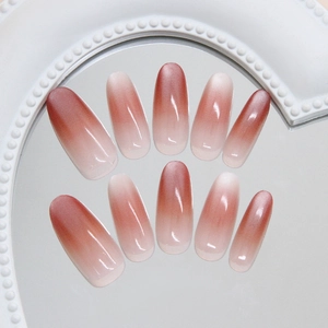 Elegant almond ombre press-on nails with cat eye shimmer and a glossy gradient finish