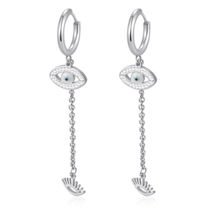 Detail of silver evil eye dangle earrings with blue stones and long fringe chains