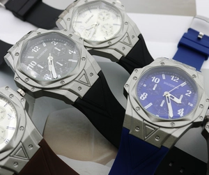 Detail of men's sports watches with silicone straps and octagonal screw bezels