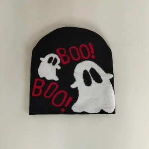 Detail of black knit beanie featuring white ghost patterns and red BOO text design