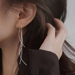 Elegant S925 sterling silver tassel drop earrings on model showing minimalist linear style