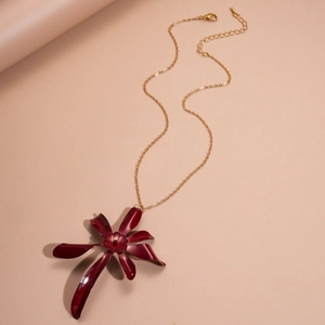 Detail of dark red layered flower pendant with gold chain and lobster clasp