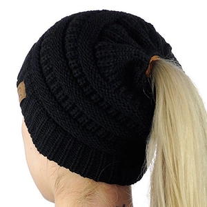 Women's black cable knit beanie with functional ponytail hole design and C.C leather tag