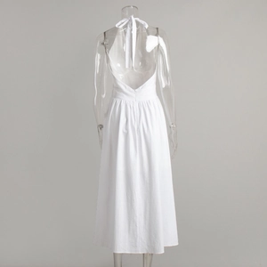 Detail view of white halter neck maxi dress with deep backless V-cut and bow tie closure