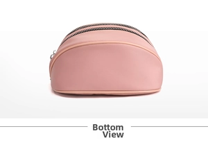 Detailed bottom view of pink semi-circular cosmetic bag with double zipper structure