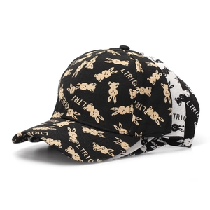 Detail of stacked baseball caps featuring jacquard rabbit patterns and LTRIC embroidery
