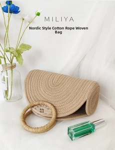 Detail of minimalist beige cotton rope woven tote bag with circular handles