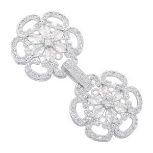 Macro shot of silver-colored flower-shaped connector buckle with micro-set cubic zirconia