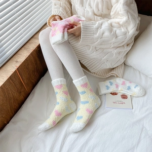 Yellow coral fleece thermal crew socks with blue heart pattern for winter home comfort