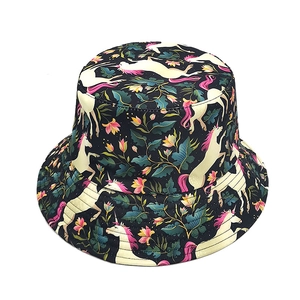 Close-up of the vibrant unicorn and floral pattern on this stylish black bucket hat