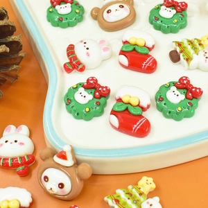 DIY Christmas resin accessories set with wreaths, stockings, and cute animals in a tray