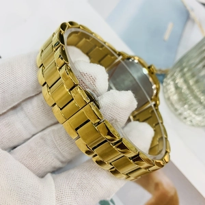 Classic gold stainless steel watch with a minimalist link strap and secure folding clasp