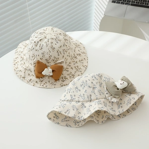 Floral baby bucket hats with cute bunny bow details in brown and blue floral patterns