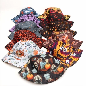 Halloween bucket hats with pumpkin and skull prints in various colors on white background