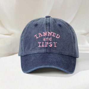 Washed blue denim baseball cap with pink TANNED and TIPSY embroidery for outdoor style