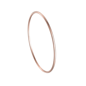 Macro detail of 2mm minimalist rose gold titanium steel bangle with polished mirror finish