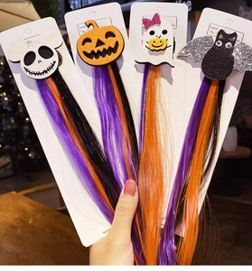 Detail of Halloween hair extensions with skull, pumpkin, ghost and bat clips for costumes