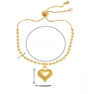 Detail view of gold heart charm bracelet with adjustable bead chain and size dimensions