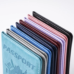 Multi-color PU leather passport covers with globe embossing in seven vibrant shades