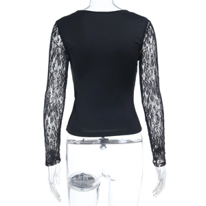 Detailed back view of black top featuring sheer crochet lace sleeves on a mannequin