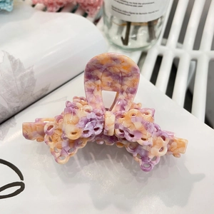 Elegant marble pattern acetate bow hair claw clip in purple and orange tones