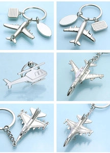 Detailed grid showing various silver metal aircraft keychains in airplane models