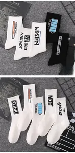 Detail of trendy cotton crew socks with creative graphic prints and ribbed cuffs