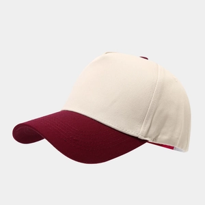 Side view of two-tone baseball cap with cream crown and burgundy brim in cotton twill