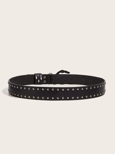 Detail of black punk leather belt featuring double row metal rivets and unique buckle