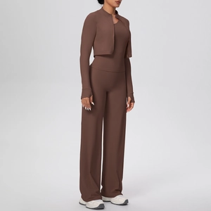 Detail of chocolate brown 3-piece yoga set featuring zip-up jacket and wide-leg pants