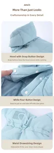 Detail view of light blue quilted pet coat showing snap fasteners and adjustable waist drawstring