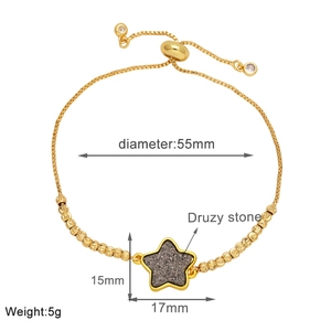 Close-up of adjustable gold star bracelet with druzy stone inlay and size specifications