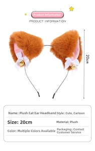 Detail showing plush cat ear headband with pink inner lining, bow, and gold bell charms