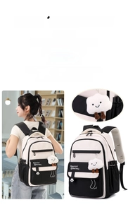 Detail of waterproof nylon school backpack with cute plush cloud keychain and floral print