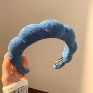 Blue towel fabric sponge headband with puffy cloud design and hand made tag