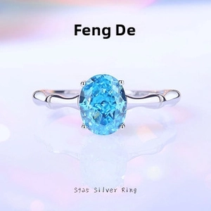 Macro shot of S925 sterling silver ring featuring bamboo texture and oval blue stone