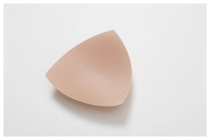 Close-up of seamless nude triangle bra pads with breathable foam and micro markings