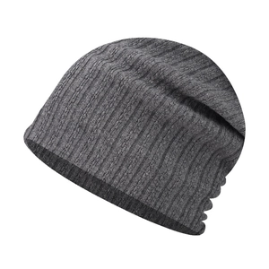 Close-up of charcoal grey beanie showing vertical ribbed knit texture and fine patterns