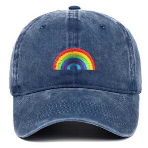 Detail of colorful rainbow embroidery on navy blue washed denim baseball cap