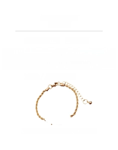 Detailed view of gold rope chain bracelet with cubic zirconia and extension chain specs