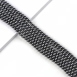 Strands of 6mm terahertz round beads with polished metallic finish for jewelry making