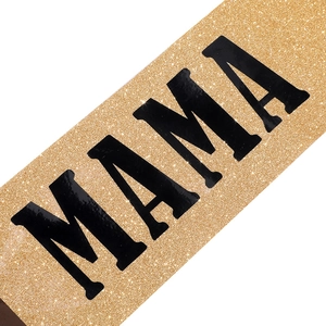 Close-up of gold glitter sash with black MAMA text for Mother's Day party outfits