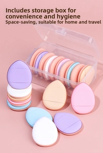 Detailed view of colorful mini finger powder puffs in a transparent storage case