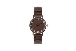 Macro detail of brown quartz watch with vintage dual-shadow numerals and elastic strap