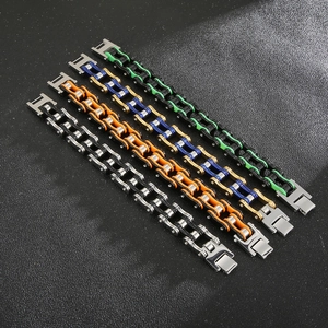 Close-up of multicolored stainless steel bicycle chain bracelets on black background