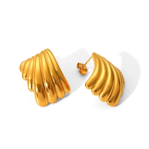 Macro detail of gold plated stainless steel shell earrings with wavy 3D texture